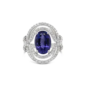 Elegant Curved Tanzanite and Diamond Ring in White Gold