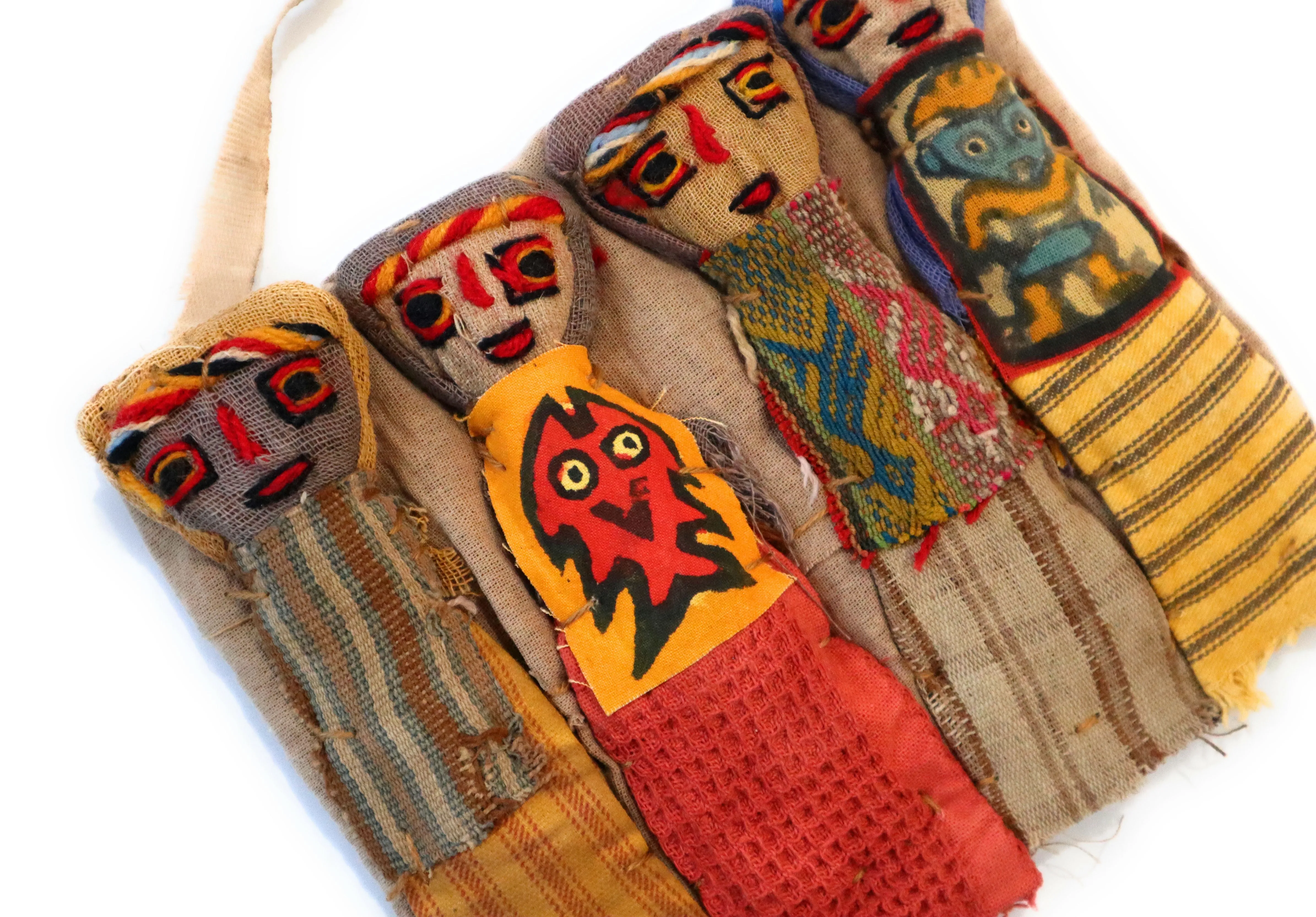 Funerary Dolls, Fertility Amulet Wall Hanging. Four Dolls Wrapped on Handwoven Traditional Peruvian Textile. 8" W x 6" H.