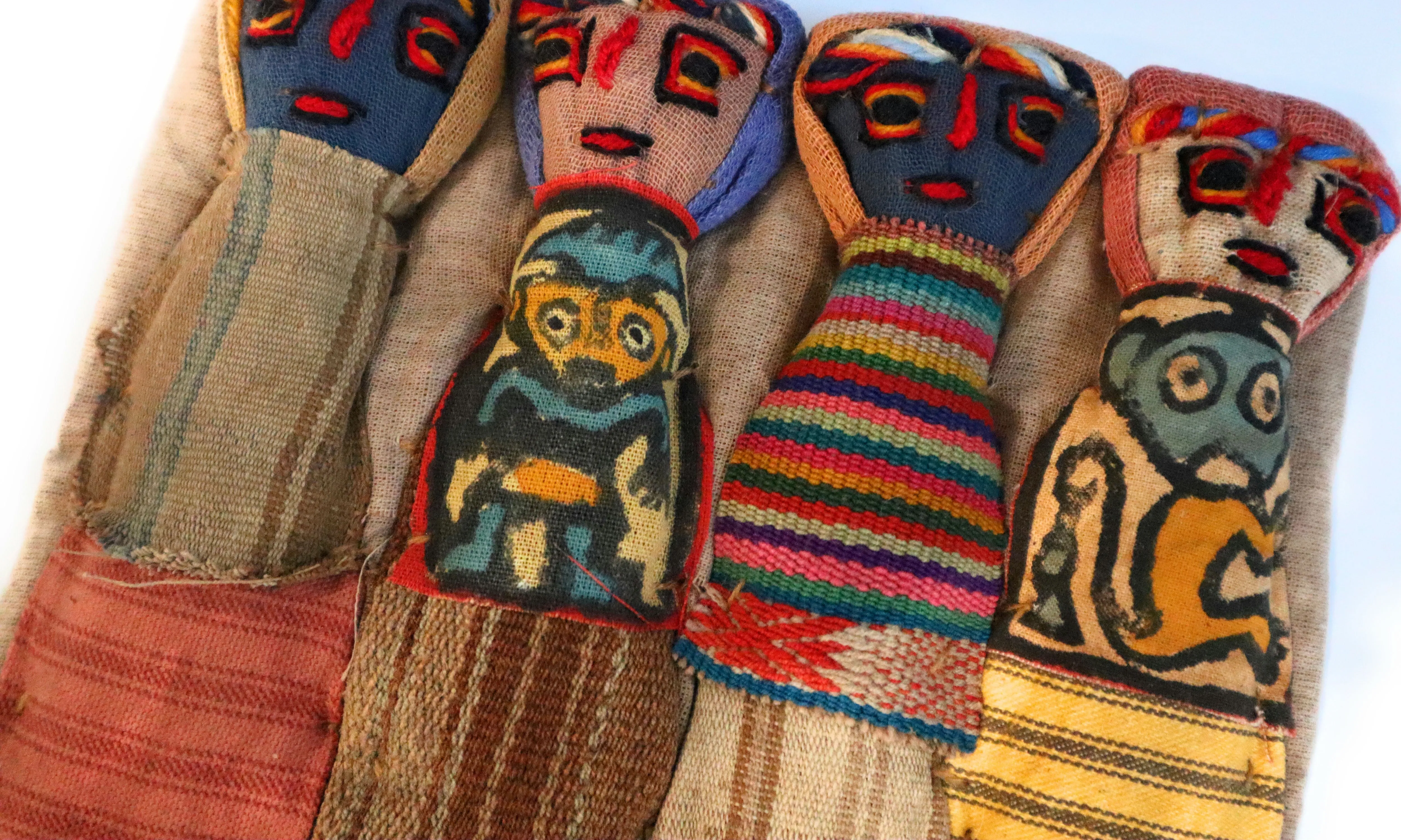 Funerary Dolls, Fertility Amulet Wall Hanging. Four Dolls Wrapped on Handwoven Traditional Peruvian Textile. 8" W x 6" H.