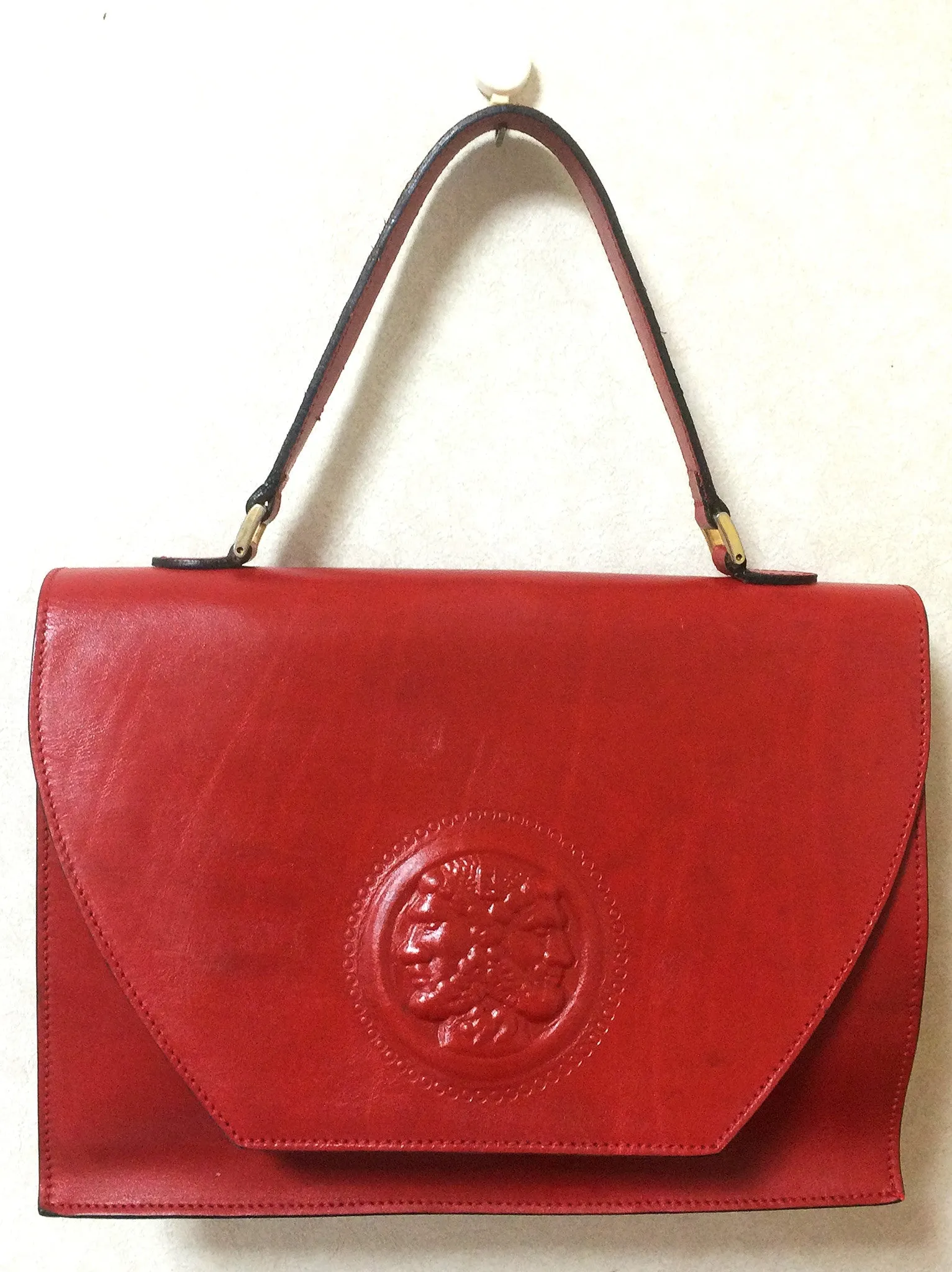 Vintage FENDI genuine red leather classic handbag with iconic Janus medallion embossed motif at front. 050628ya1