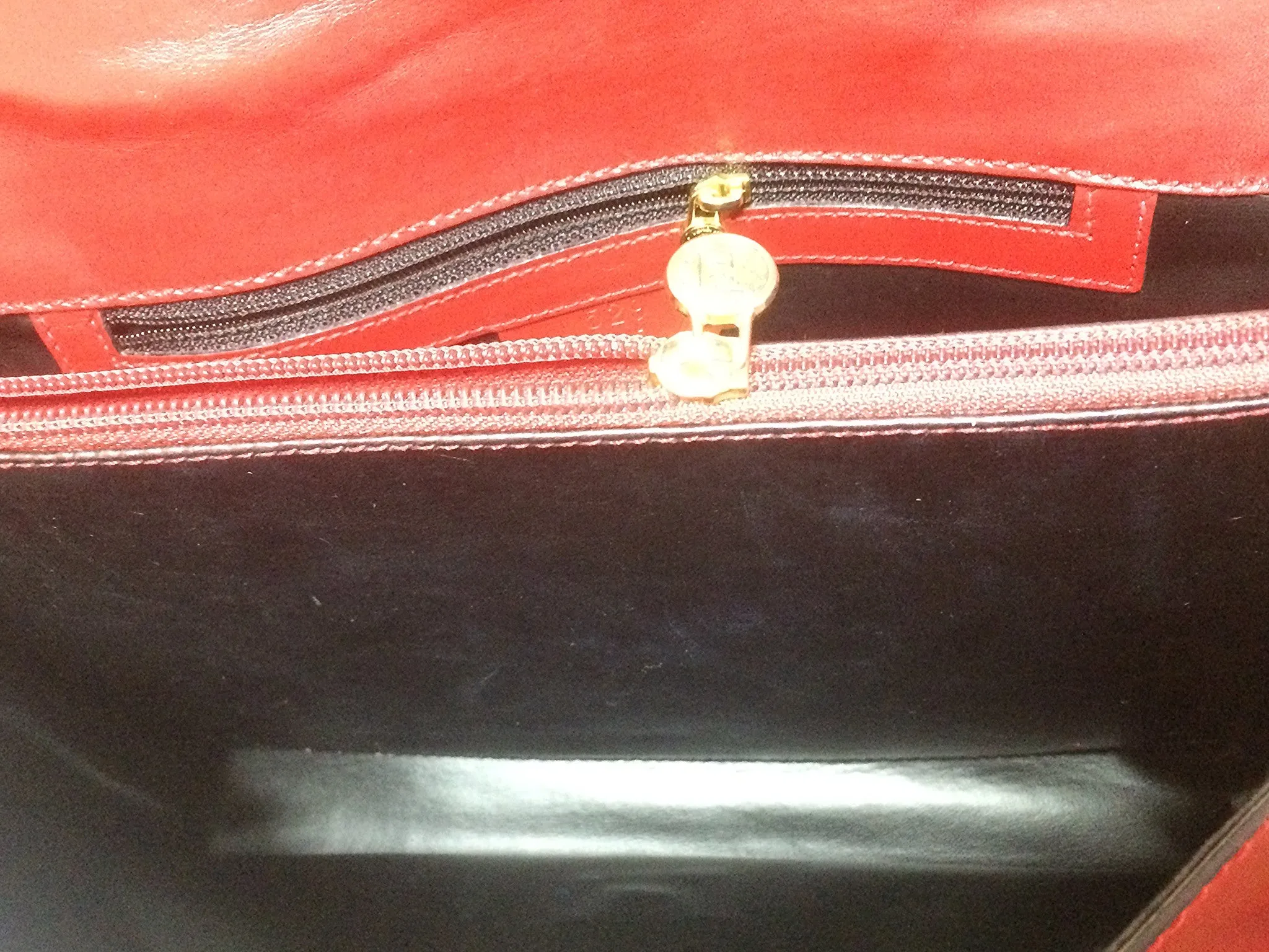 Vintage FENDI genuine red leather classic handbag with iconic Janus medallion embossed motif at front. 050628ya1