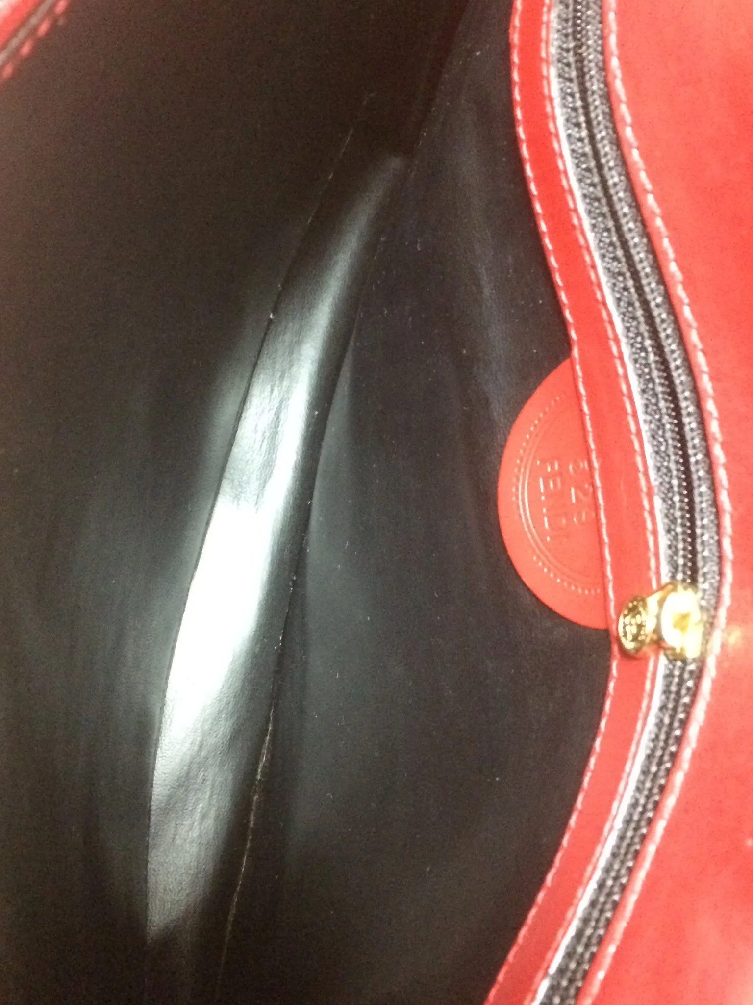 Vintage FENDI genuine red leather classic handbag with iconic Janus medallion embossed motif at front. 050628ya1