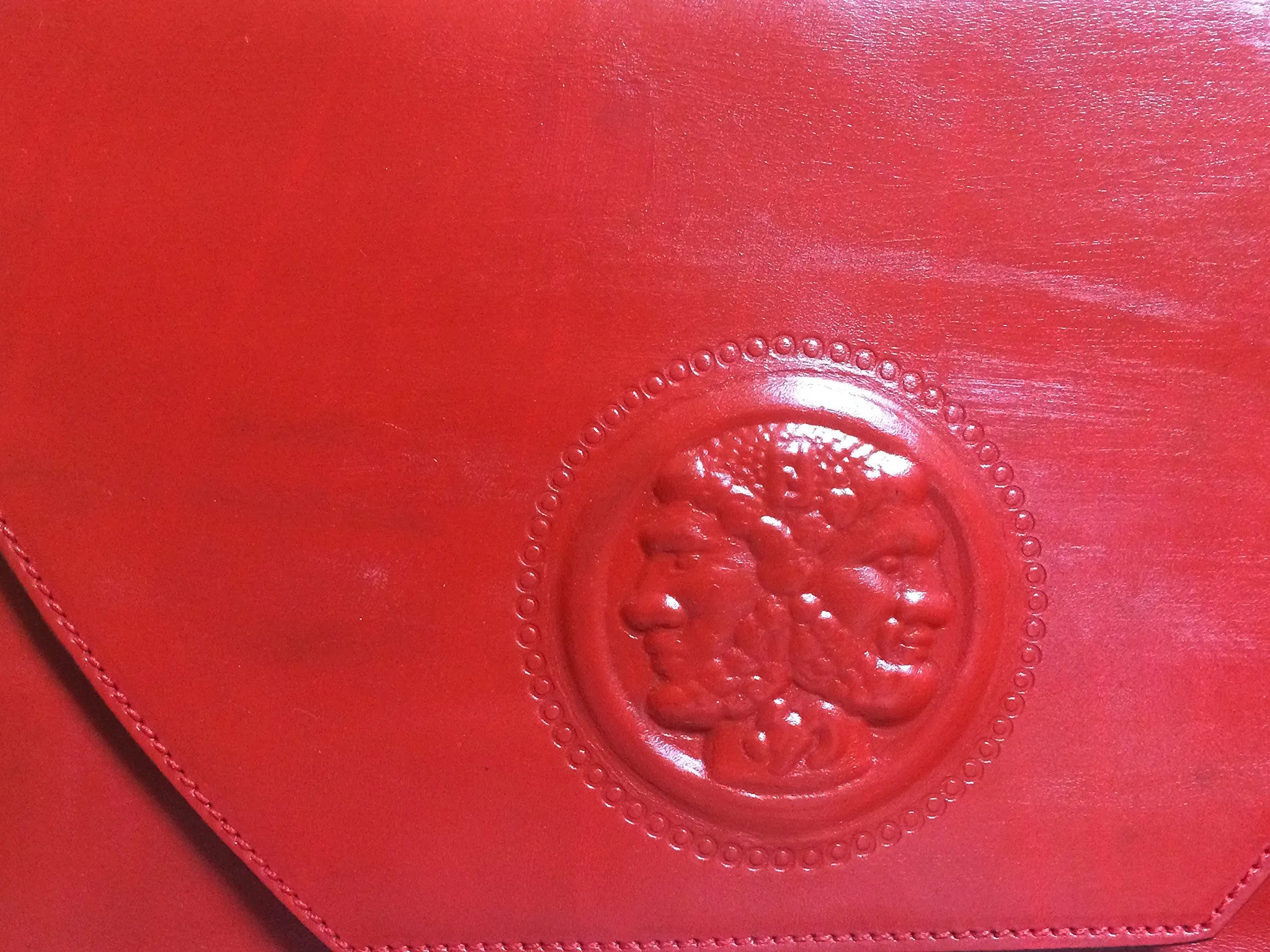 Vintage FENDI genuine red leather classic handbag with iconic Janus medallion embossed motif at front. 050628ya1