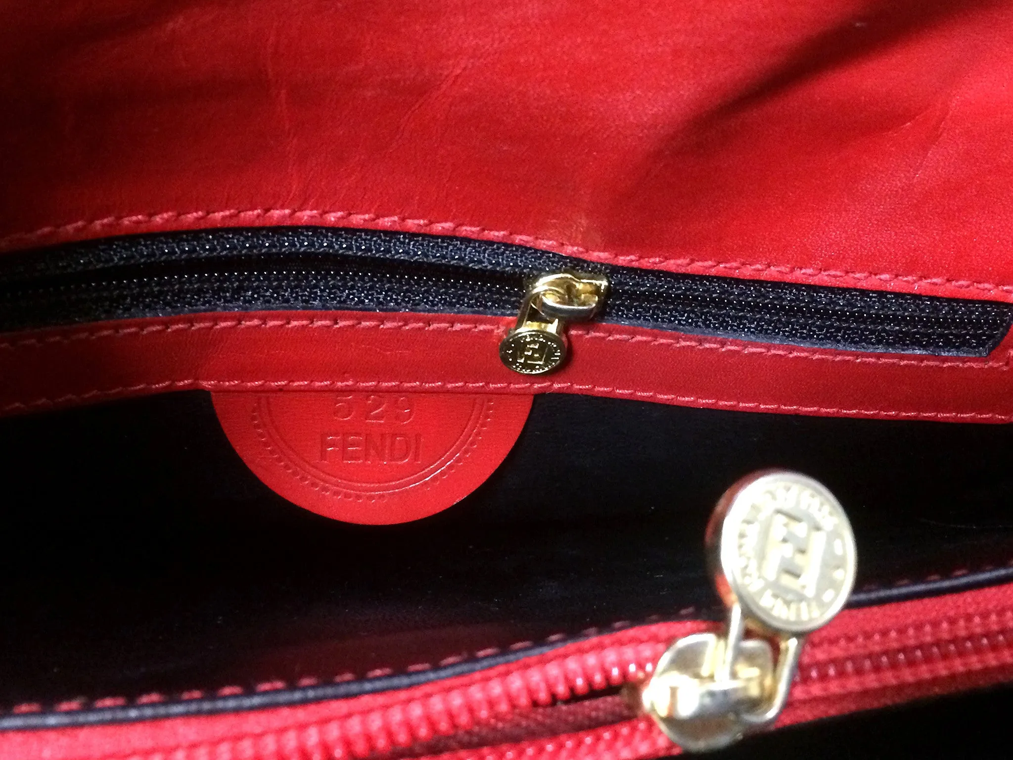 Vintage FENDI genuine red leather classic handbag with iconic Janus medallion embossed motif at front. 050628ya1