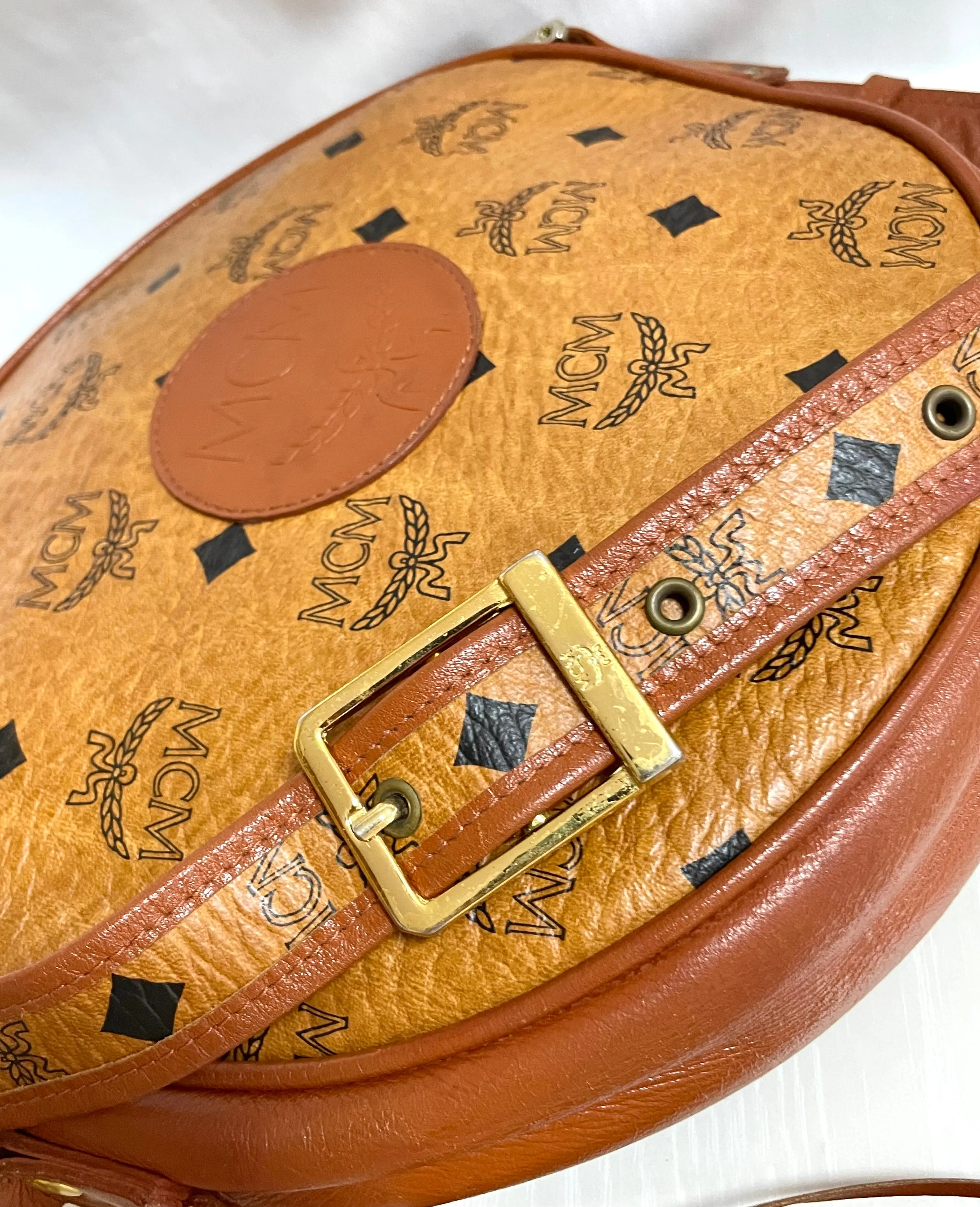 Vintage MCM brown monogram round Suzy Wong shoulder bag with brown leather trimmings. Designed by Michael Cromer. Unisex. 050524ra1