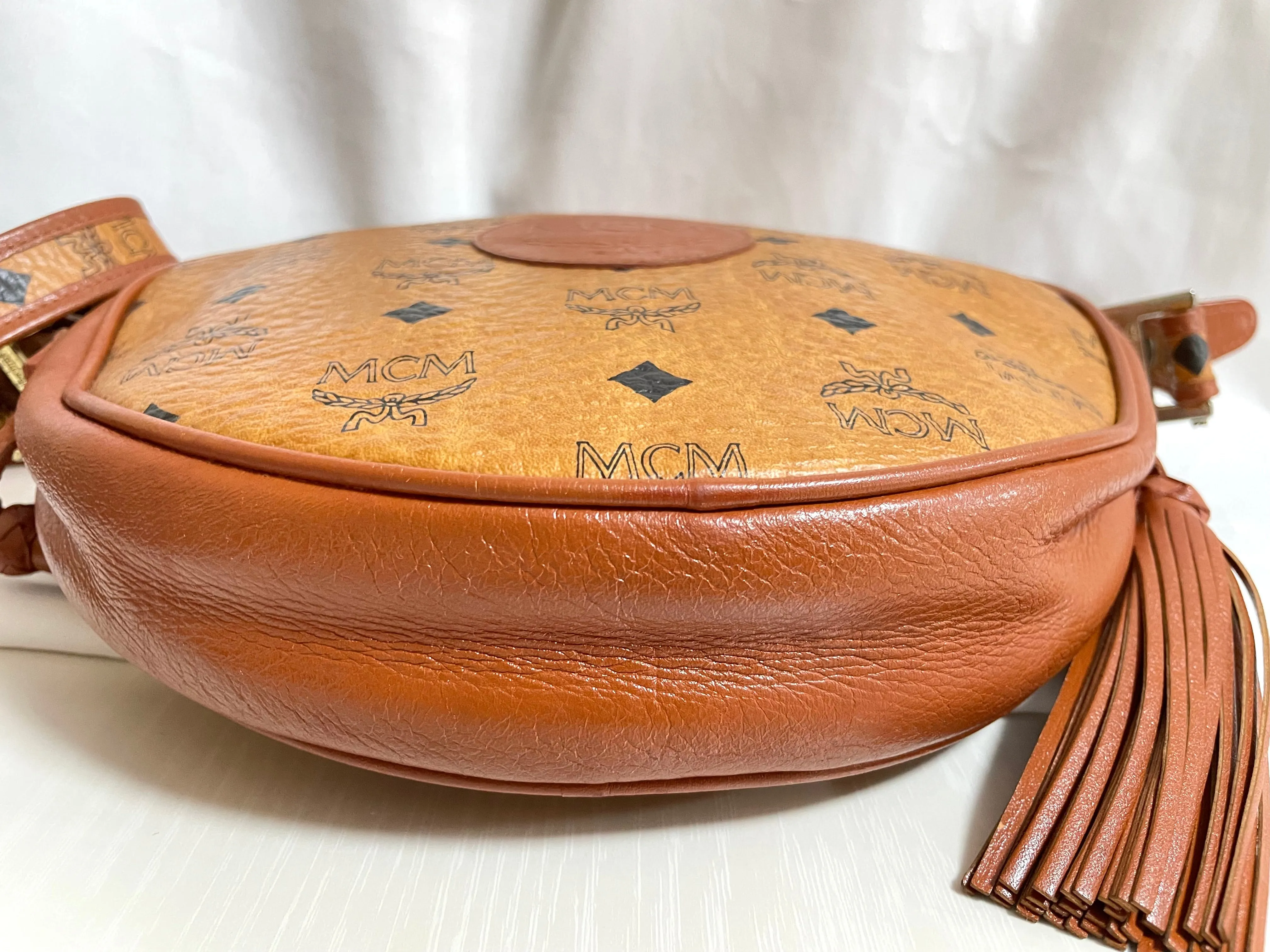 Vintage MCM brown monogram round Suzy Wong shoulder bag with brown leather trimmings. Designed by Michael Cromer. Unisex. 050524ra1